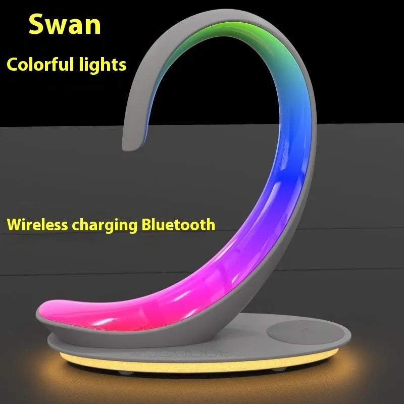 White swan shaped desktop wireless charger with Bluetooth speaker and colourful atmospheric lighting