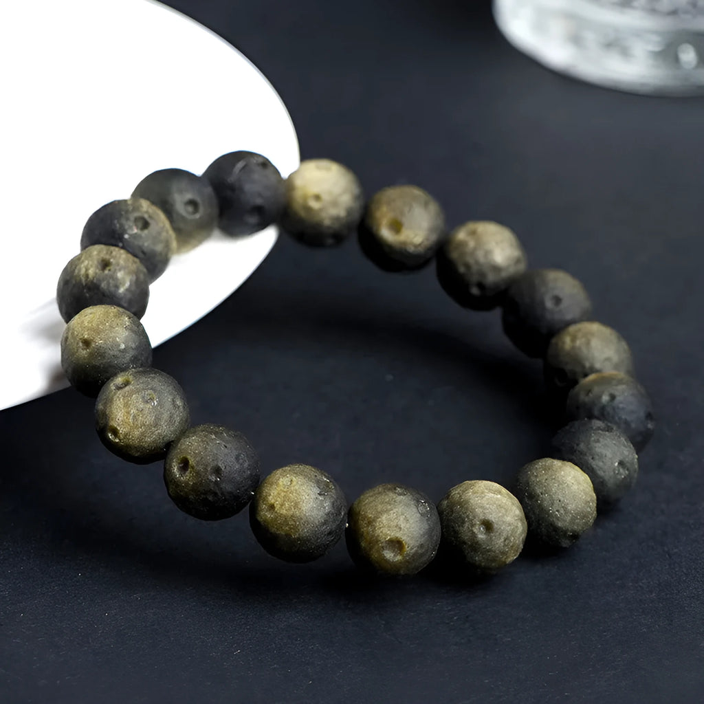 Natural obsidian crater ball bracelet with grinding texture in silver or golden meteorite colours