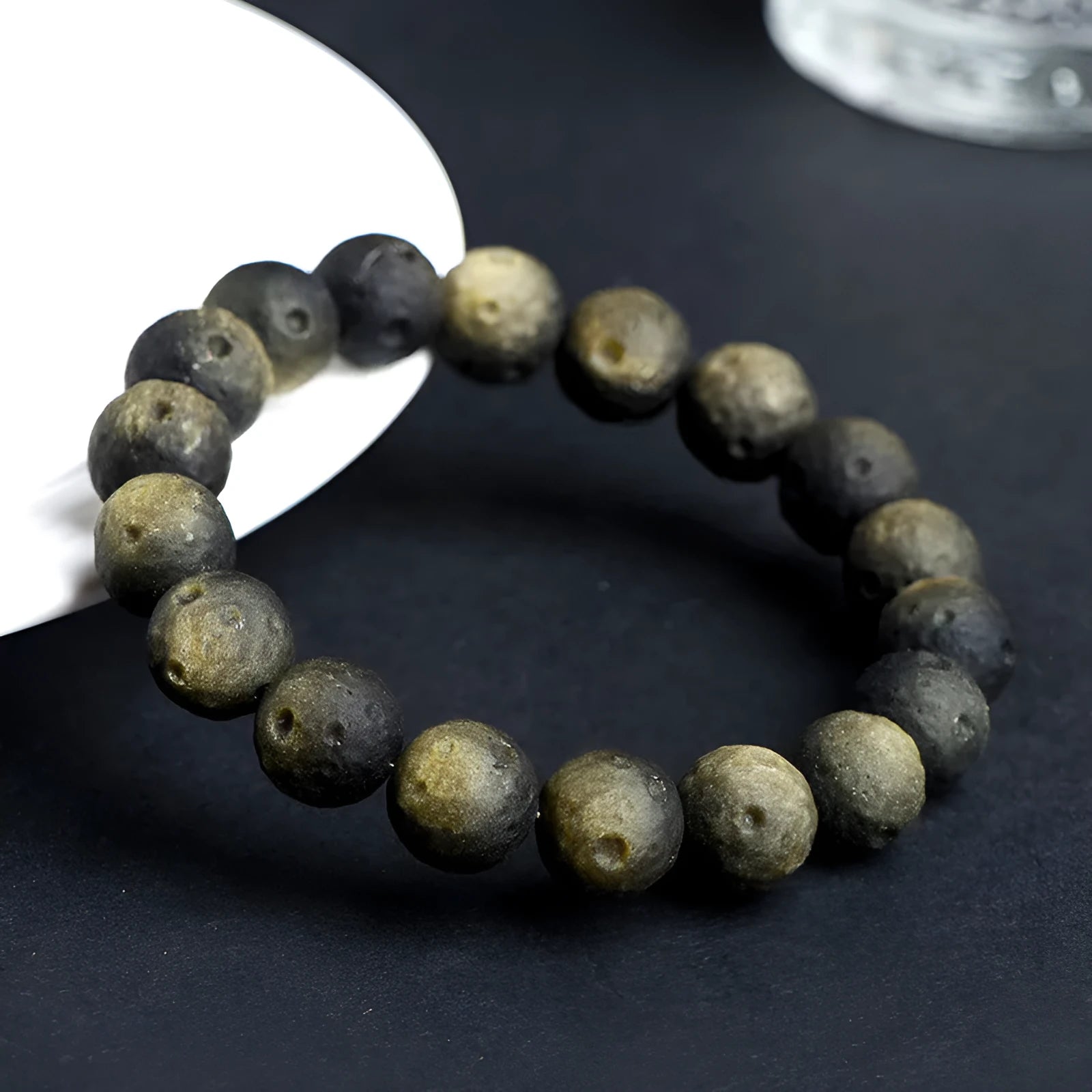 Natural obsidian crater ball bracelet with grinding texture in silver or golden meteorite colours