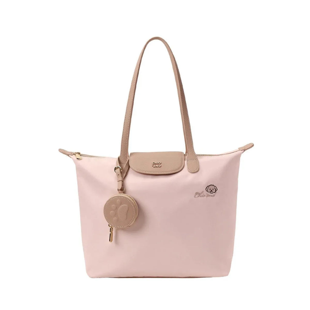 Large pink Oxford cloth tote shoulder bag showing external sandwich pocket and casual design.