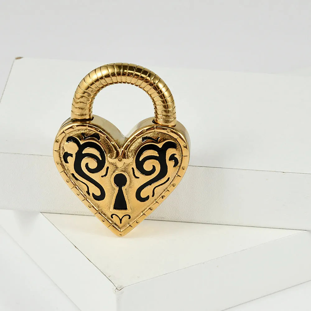 Close-up of a stainless steel heart-shaped earring with a gold-coloured electroplated finish.