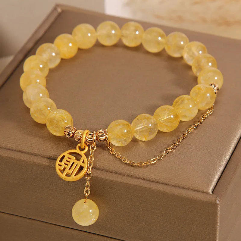 Natural stone citrine bracelet with Chinese character tassel in either Cai or Fu design