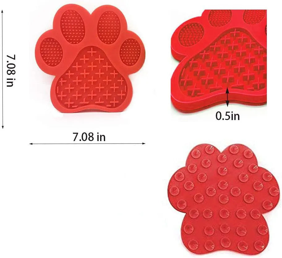 Blue bone-shaped silicone dog licking mat with suction cups on a white tile wall.