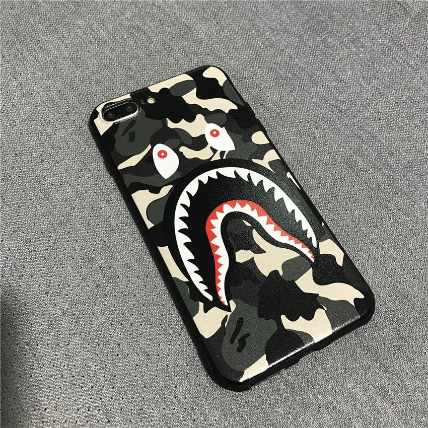 Frosted silicone phone case with shark mouth design in red, green, gray, and pink colours
