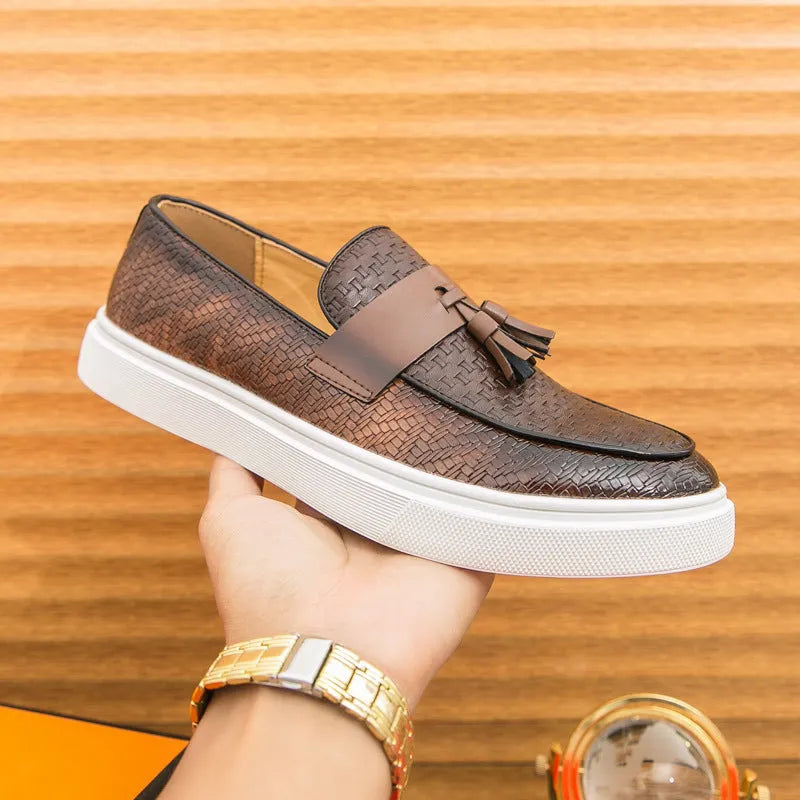 Men's black casual fringed leather shoes with a low heel and round toe on a white background.