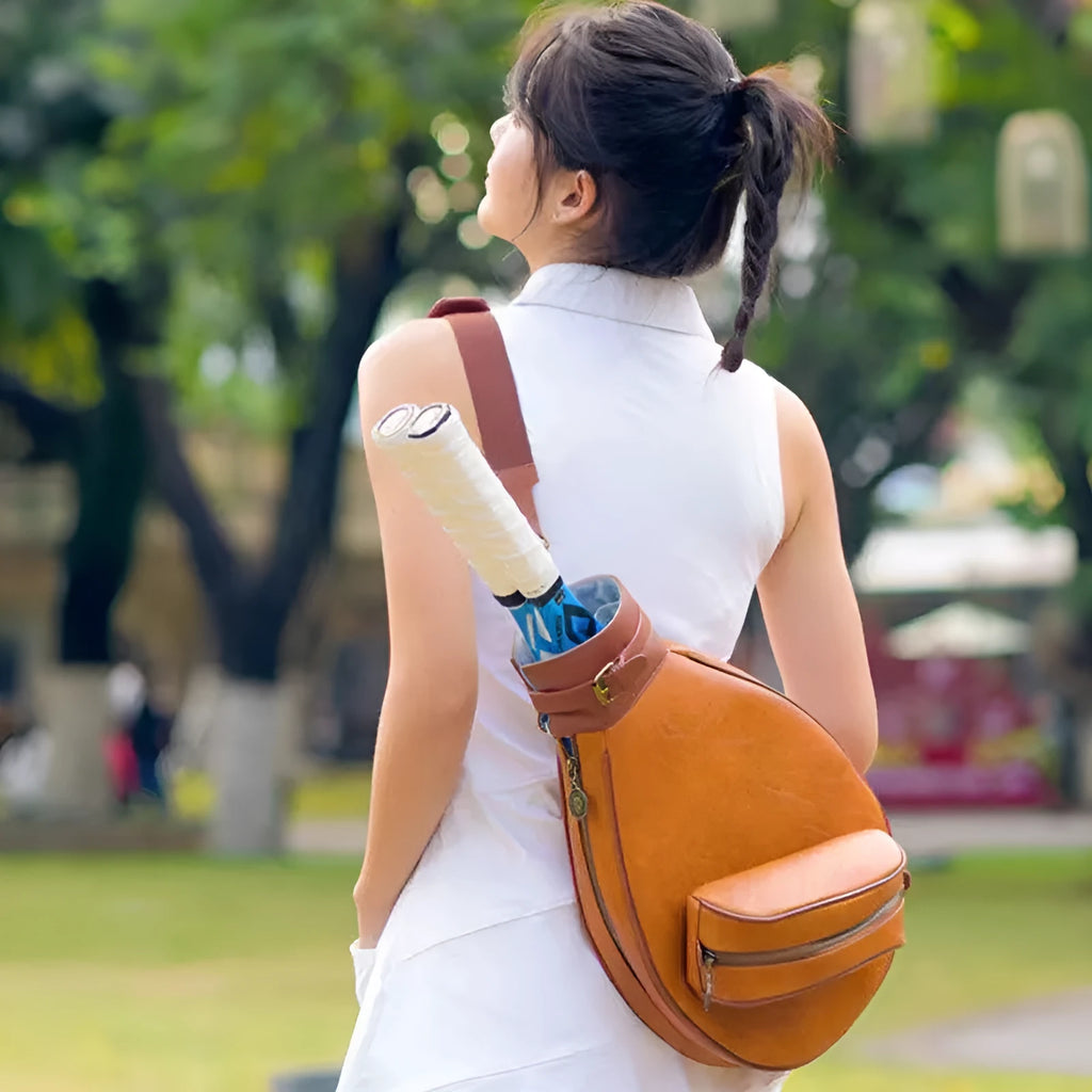 Retro-style leather badminton bag for women with a single shoulder strap, shown in a selection of colours.