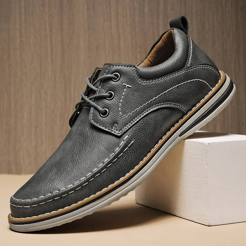 Men's black genuine leather casual lace-up shoes with round toe and low heel on a rubber sole