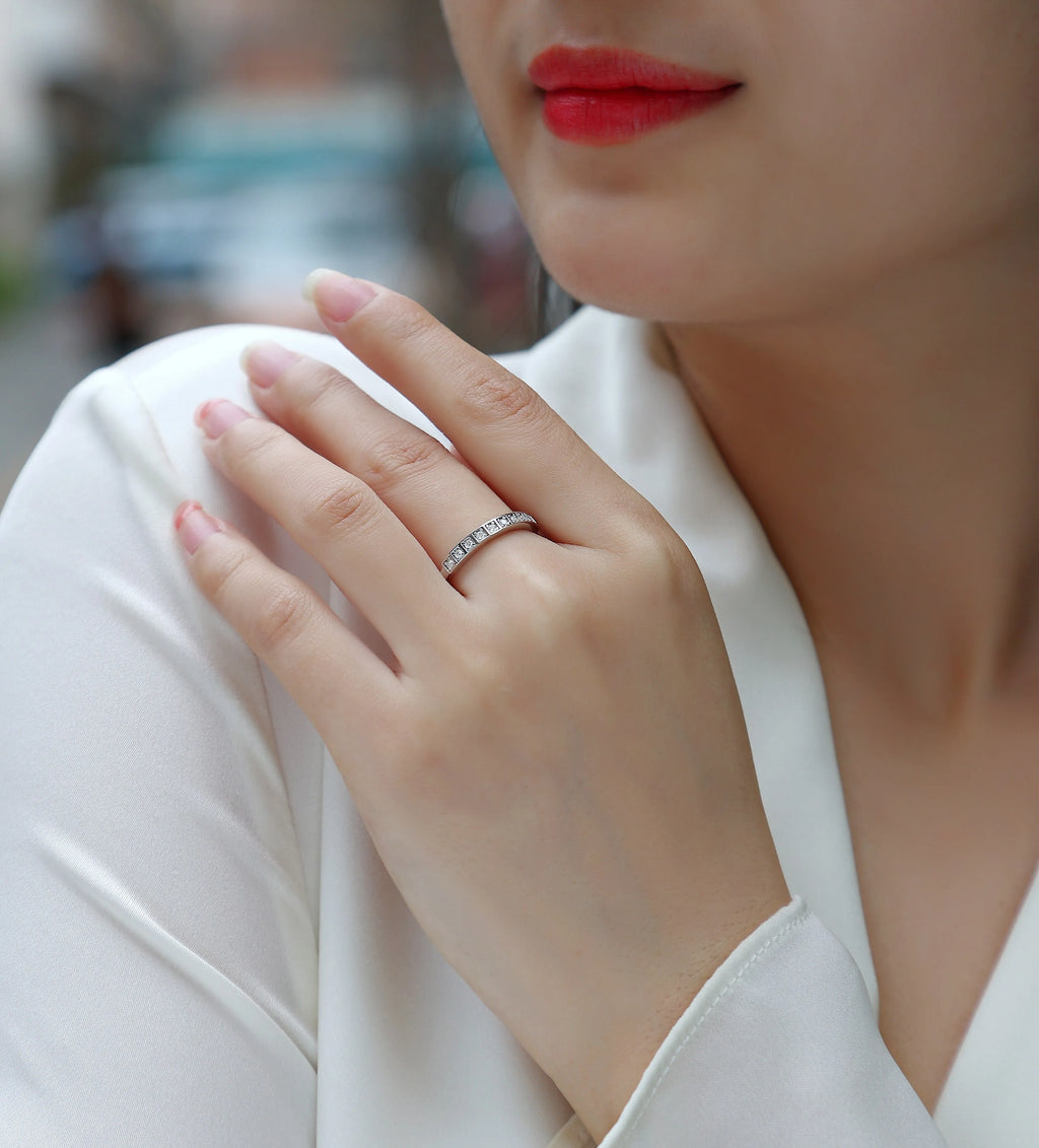 Moissanite wedding ring set on white background, S925 silver platinum plated, less than 0.1 carat stone
