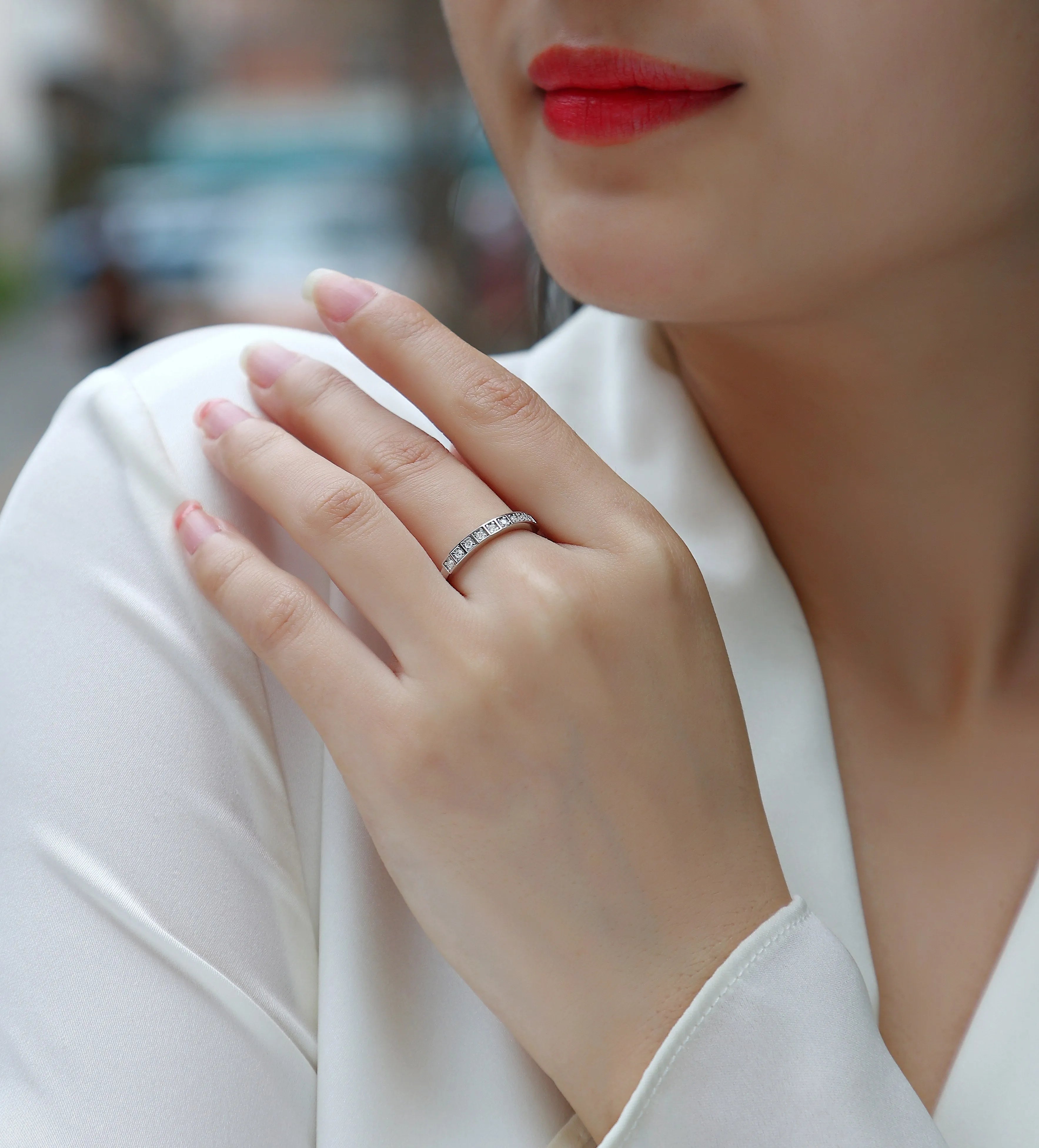 Moissanite wedding ring set on white background, S925 silver platinum plated, less than 0.1 carat stone
