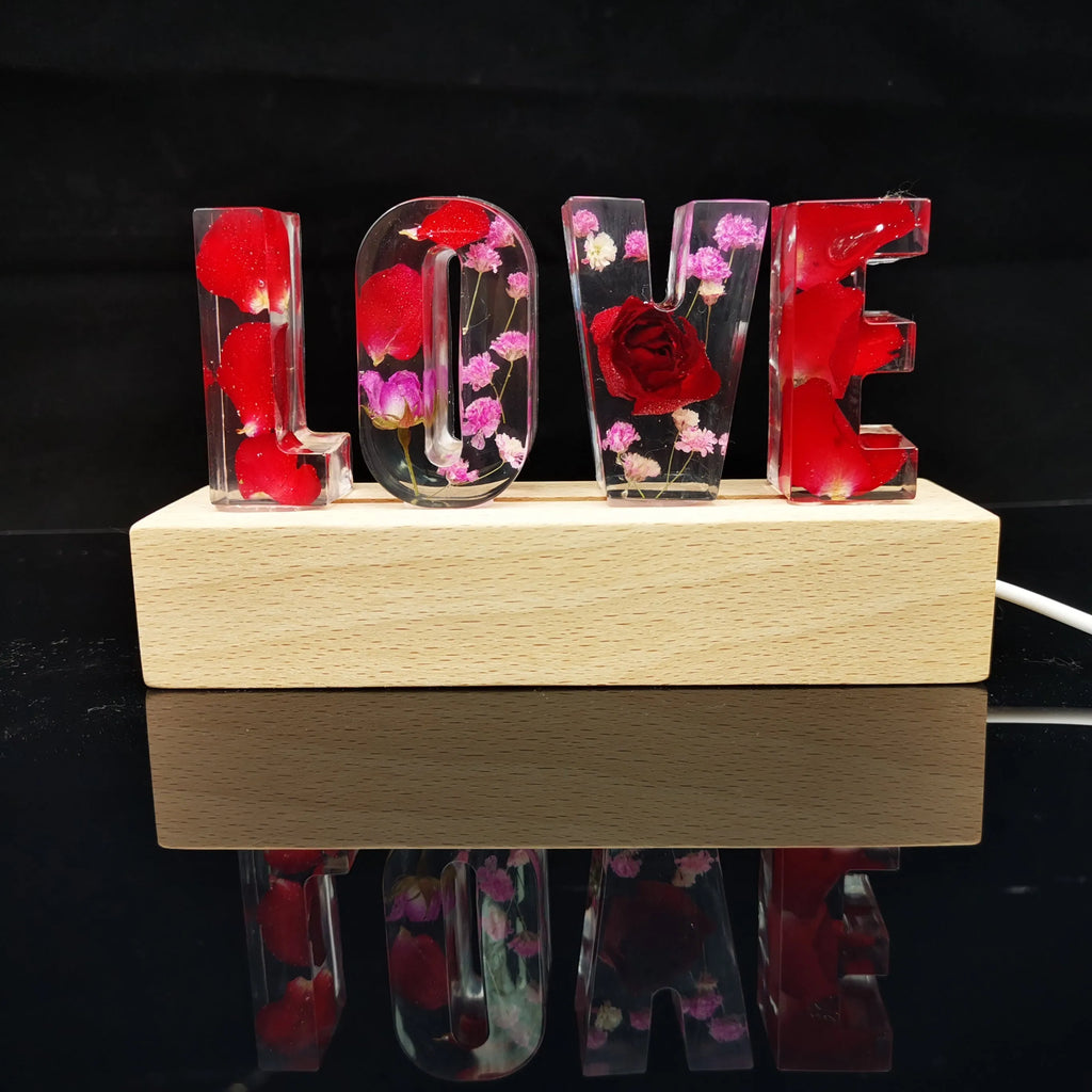 Crystal epoxy dried flower alphabet night light with white base showing letter shape