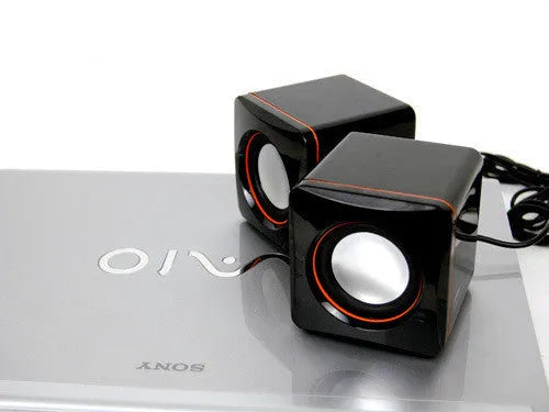 Small black square 2.0 USB computer speaker for Model 700B PC on a desk