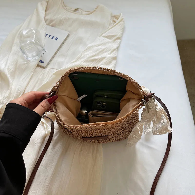 Women's straw woven messenger bag with hollowed design in khaki colour showing square shape