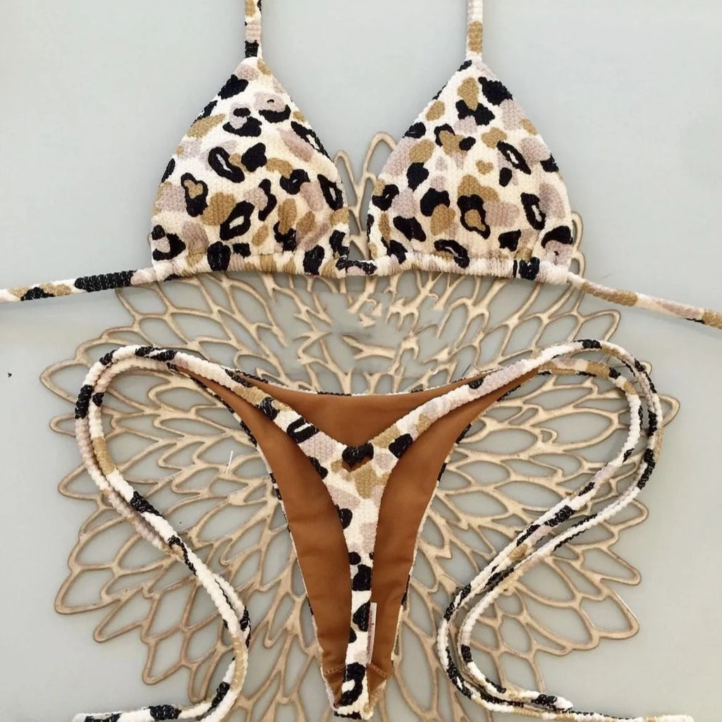 Women's blue printed bikini set with briefs, designed for swimming sports.