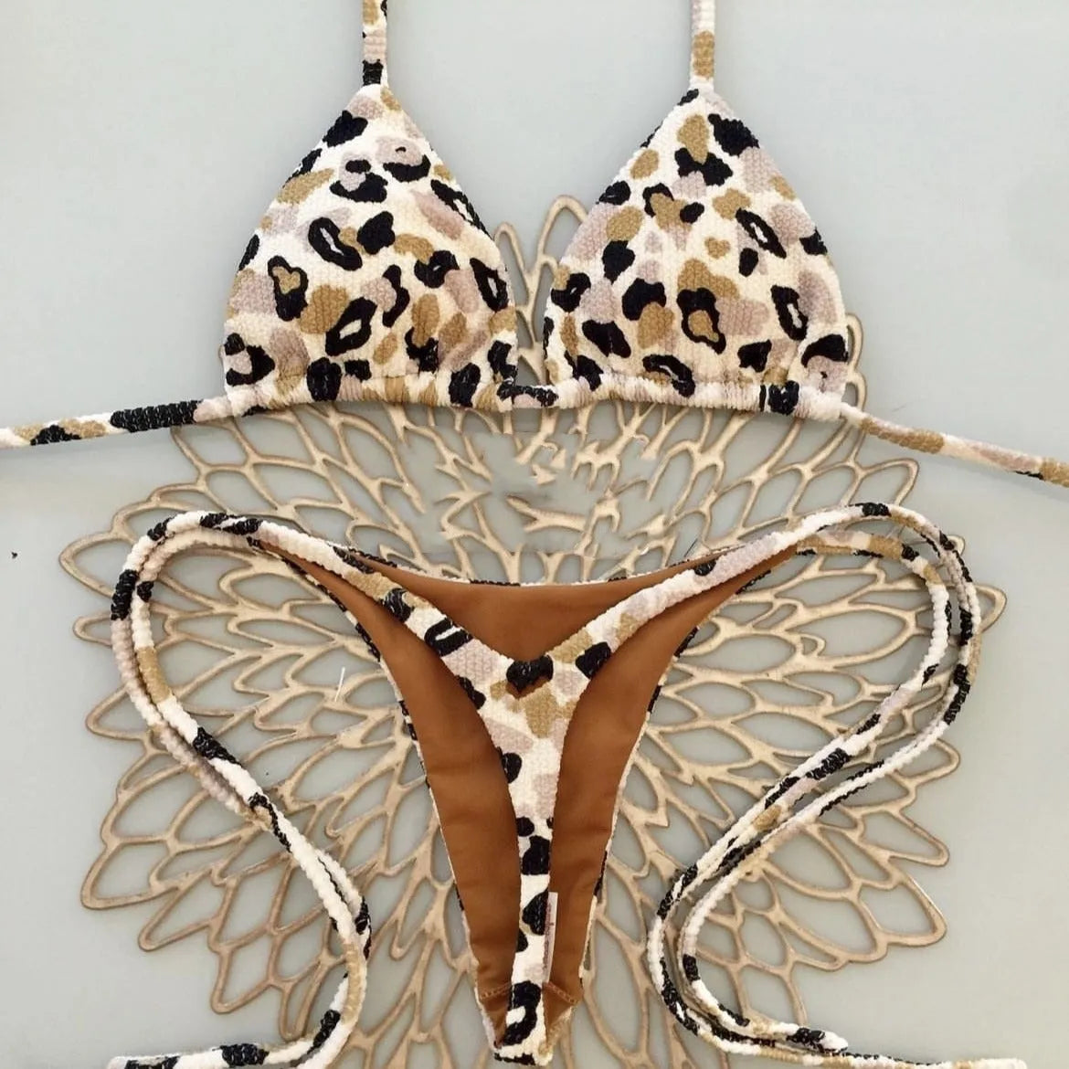 Women's blue printed bikini set with briefs, designed for swimming sports.