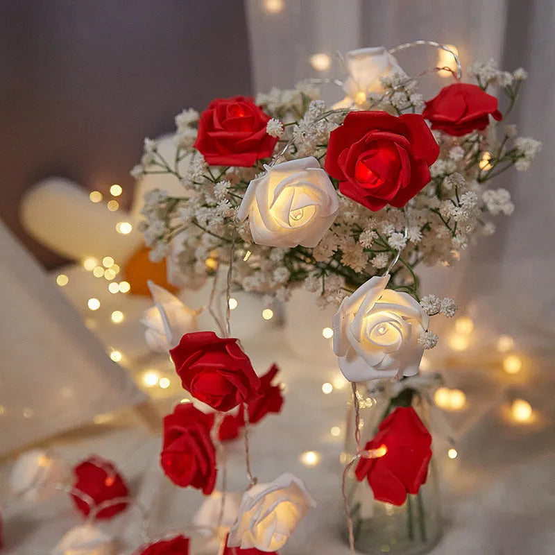 LED rose-shaped fairy light string with PV foam lamps on a 1.5m battery-powered cord for indoor holiday decoration.