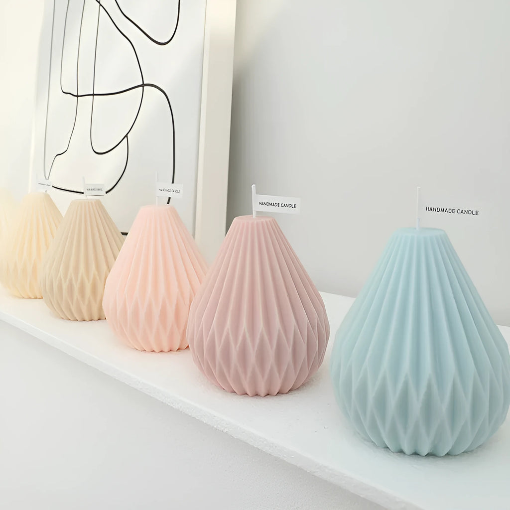 Handcrafted cylindrical soy wax scented candle with Nordic geometric lines and pear pattern in multiple colours