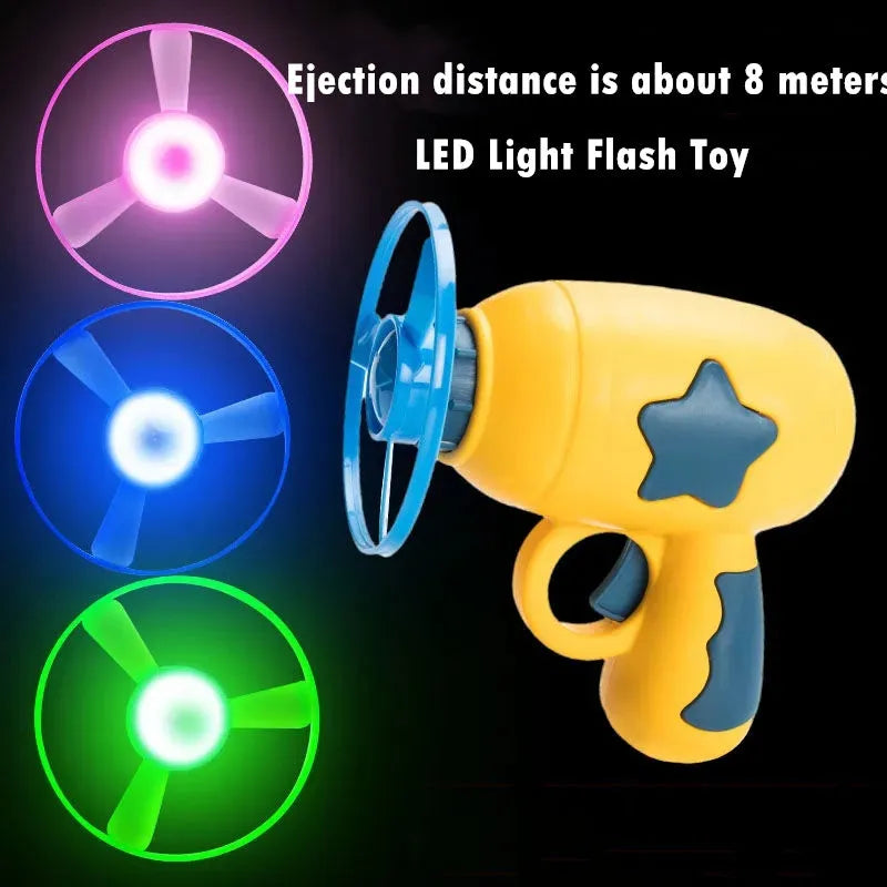 LED light-up flying saucer toy set with launcher gun, three glowing discs, and target board.