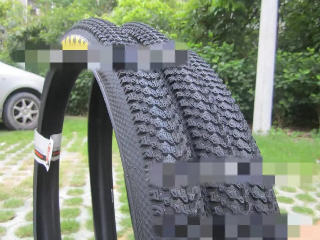 Mountain bike ultralight puncture-proof tyre showing tread pattern and white-label sidewall variant.
