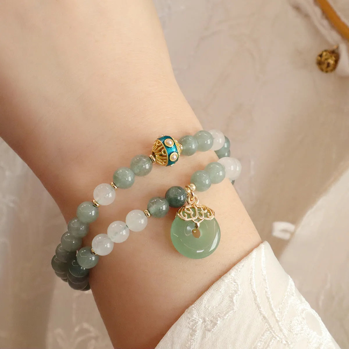 Women's Myanmar jade bracelet with Peace Buckle charm and crystal elements in geometric New Chinese style design