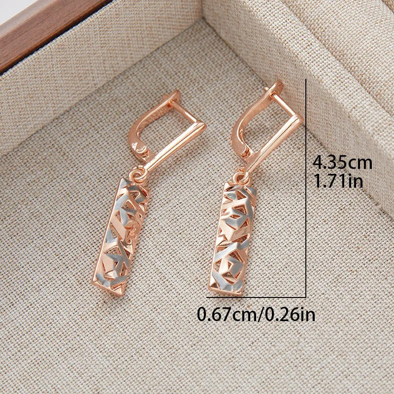 A pair of rectangular two-tone hollow stud earrings with a geometric design and picture-style colour finish.
