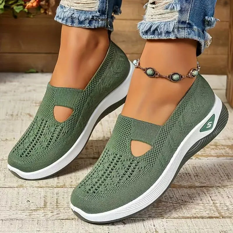 Women's light grey mesh casual flats with a T-strap and round toe on a soft PVC sole.