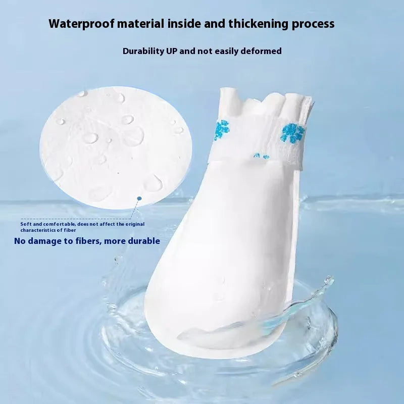 A pack of 20 white disposable waterproof shoe covers for dogs on a non-slip sole, S and M sizes.