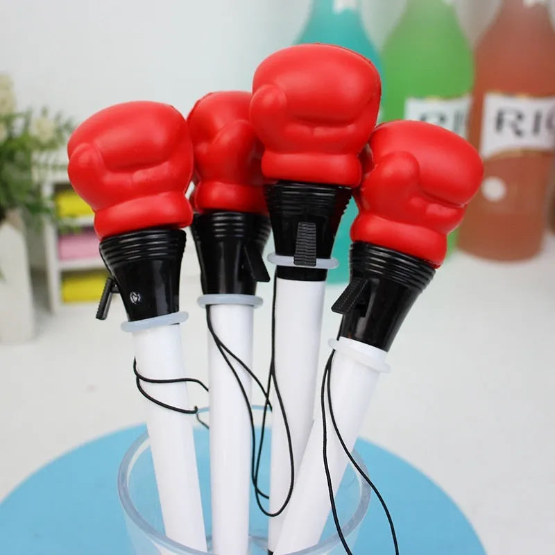Four black pressure relief pens with boxing press ejection fidget mechanism and 0.7mm tips.