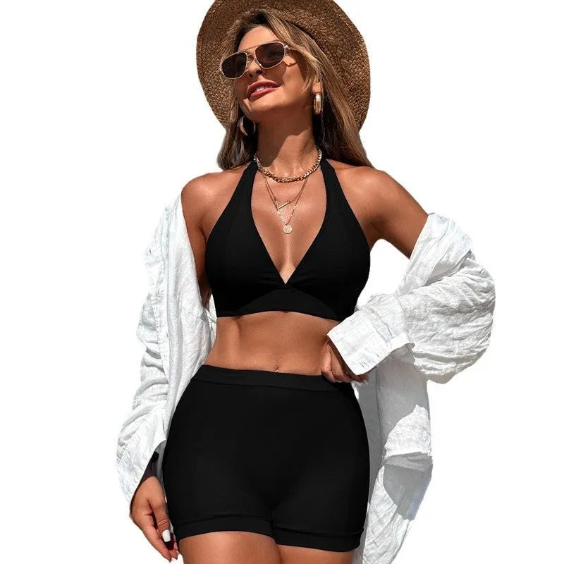 Women's split bikini swimsuit in black colour showing sleeveless design