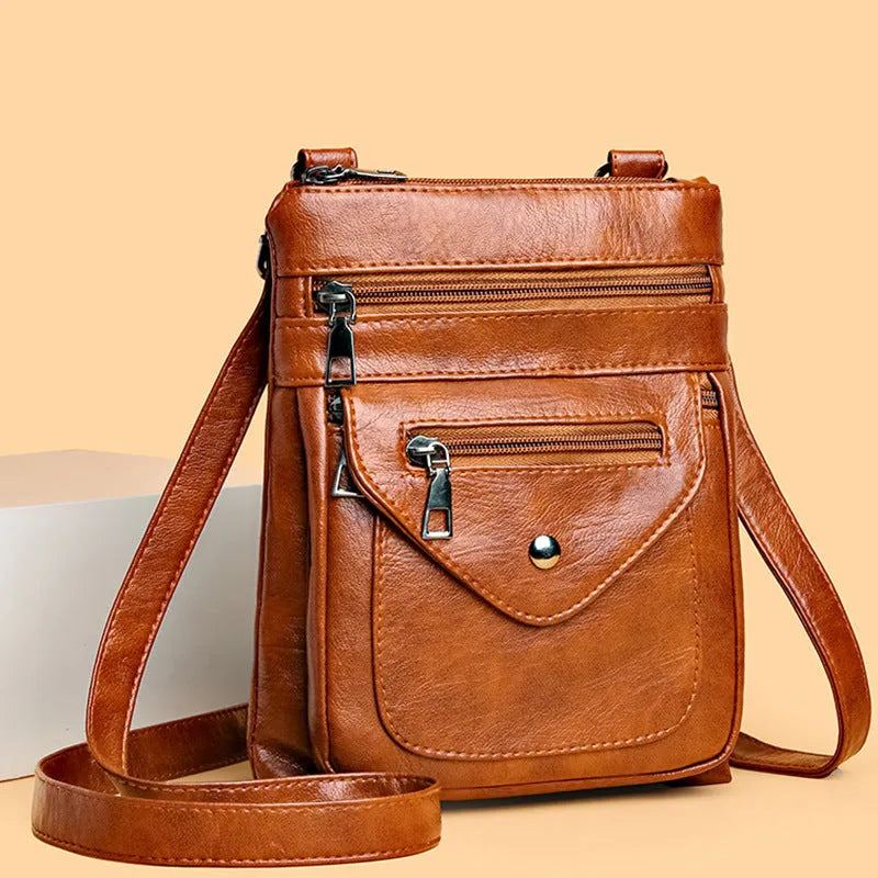 Vertical crossbody mobile phone bag in square shape with sewing line details