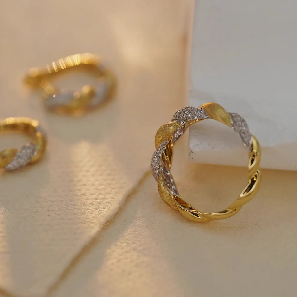 S925 sterling silver twist ring for women, yellow gold finish, geometric pointed band on white background