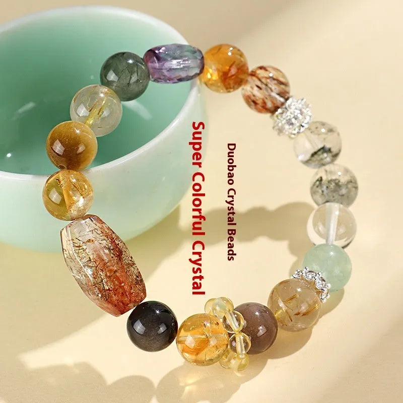 Women's natural crystal bracelet with black gold beads and adjustable slip knot closure.