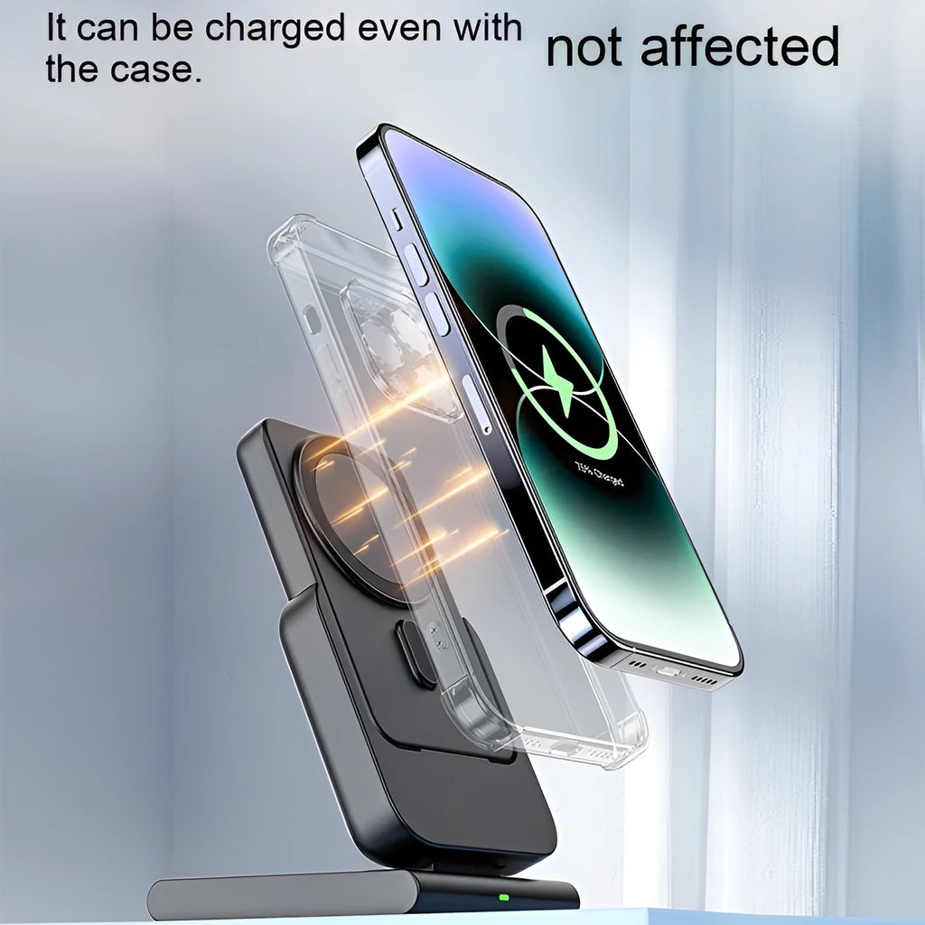 Black three-in-one magnetic power bank with folding stand charging iPhone 12, Apple Watch, and AirPods Pro wirelessly on a desk