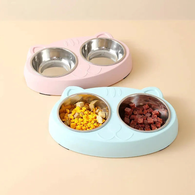 Blue macaron-shaped plastic pet feeder tray with two bowls for cat or small dog food and water.