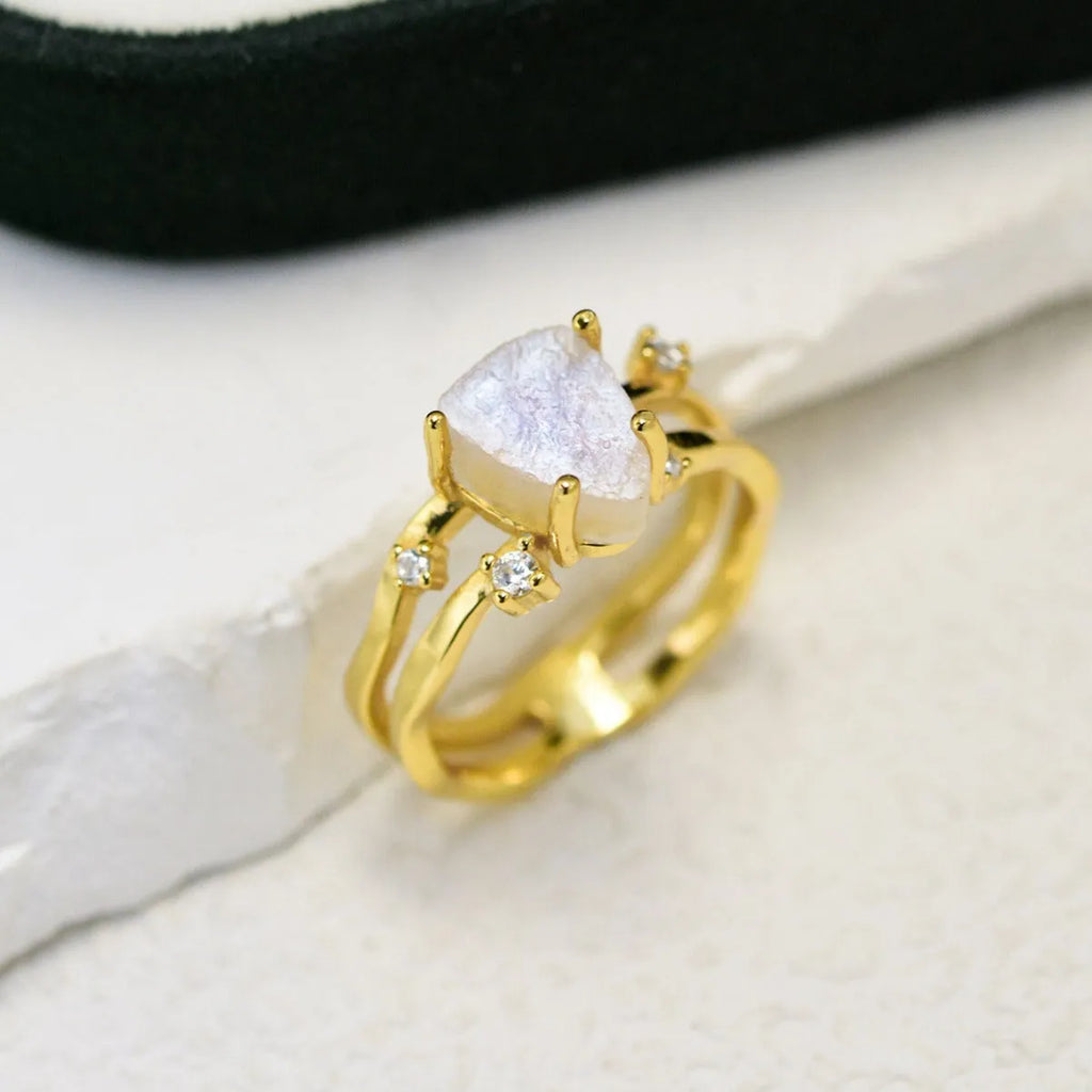 S925 silver geometric ring with triangular moonstone in rose, white, or yellow gold plating on a size guide.