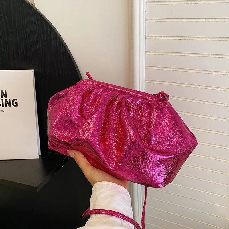 Shell-shaped PU leather crossbody bag with hair clip closure showing internal phone and document compartments