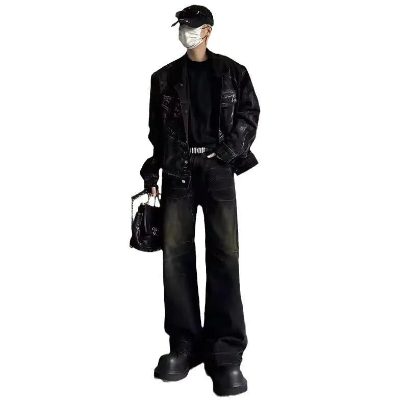 Washed black straight denim trousers with deconstructed dirty mud texture and zipper fly