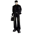 Washed black straight denim trousers with deconstructed dirty mud texture and zipper fly