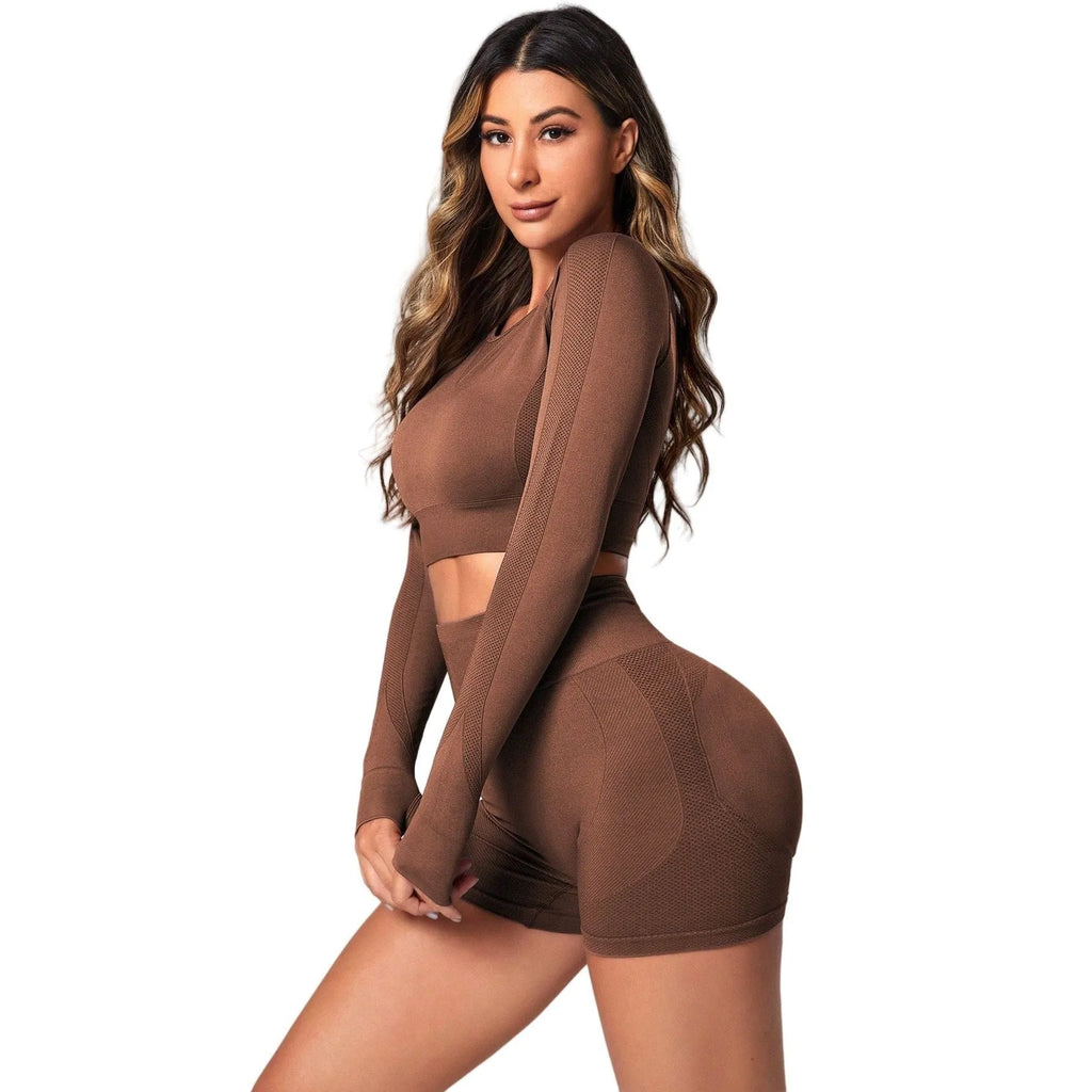 Women's black yoga suit set with long sleeve top and high-waist tight leggings laid flat.