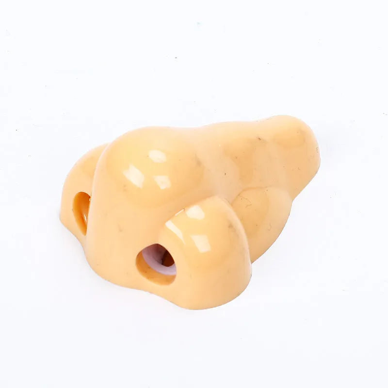 Plastic geometry-shaped manual pencil sharpener in flesh colour measuring 58x45x30mm