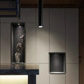 Round black surface-mounted LED ceiling downlight spotlight in modern style.