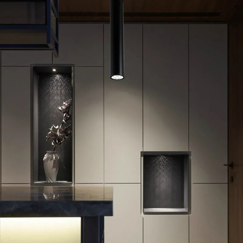 Round black surface-mounted LED ceiling downlight spotlight in modern style.