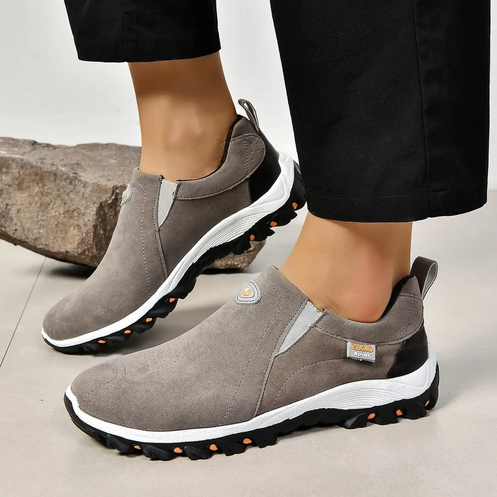 Men's grey round head overshoe cover with rubber sole, shown from the side.