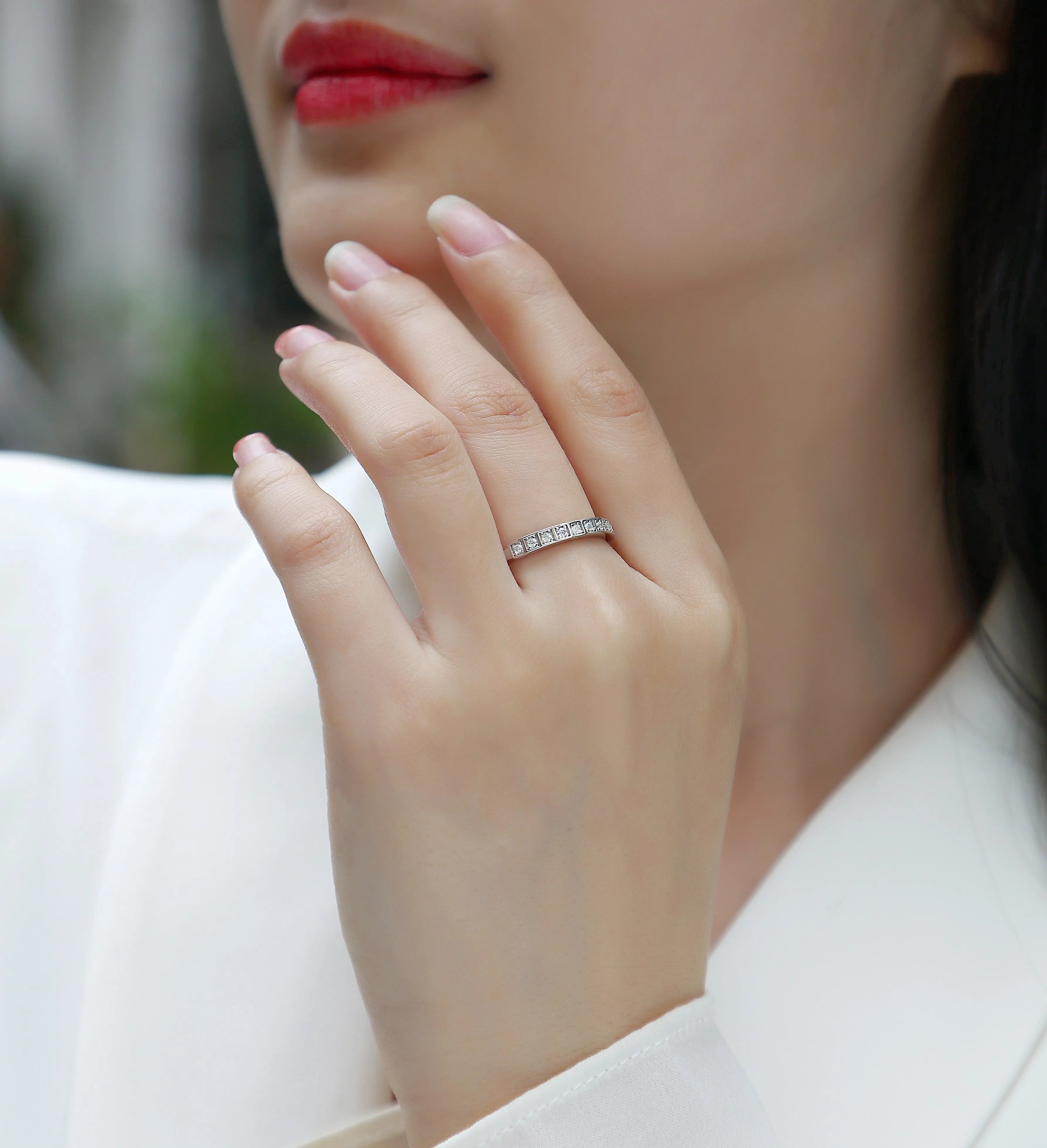 Moissanite wedding ring set on white background, S925 silver platinum plated, less than 0.1 carat stone