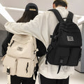Soft nylon student backpack in black colour with computer compartment and three-dimensional pockets