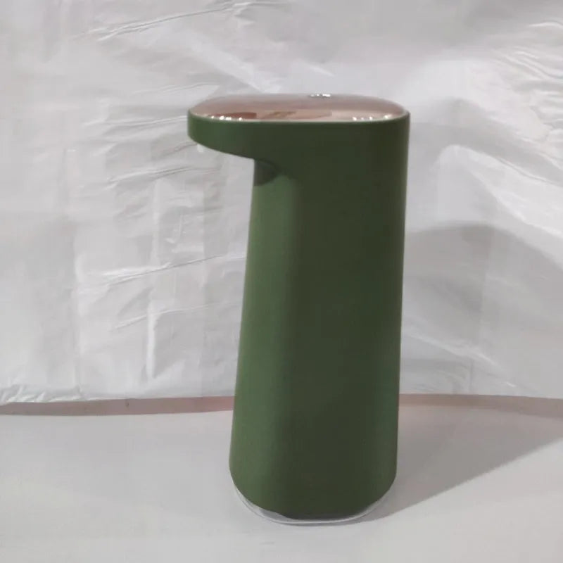 Automatic foam soap dispenser with infrared sensor in white colour on bathroom counter