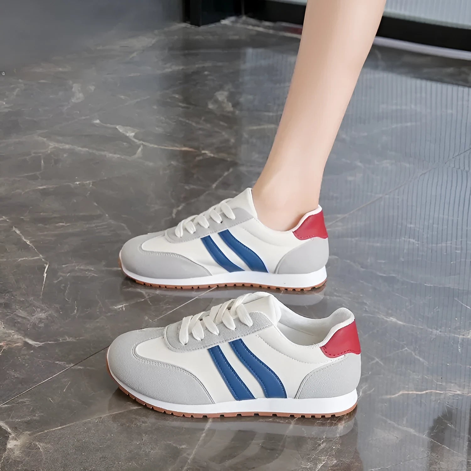 Blue and grey Cortez stripe leisure sports shoes with round toe and flat rubber sole.