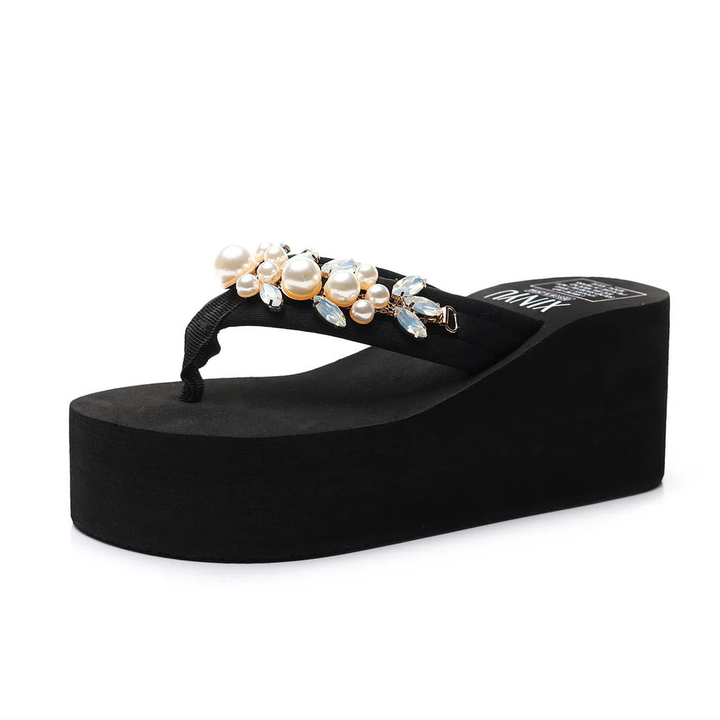Women's high-heeled flip-flops in beige and black with cotton cloth upper.