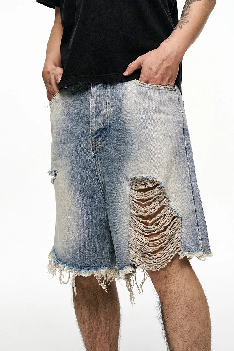 Light blue men's baggy retro denim shorts on a mid waist, showing wide leg and fifth pants length