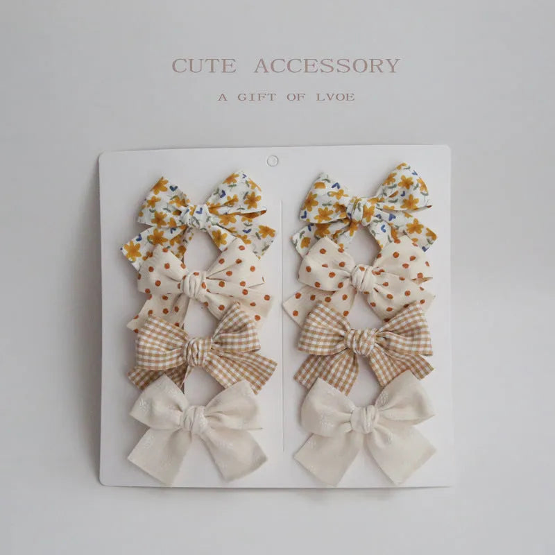 Children's fabric hairclips with dovetail bow design in multiple colour patterns