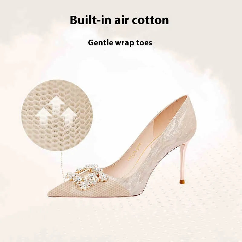 Champagne gold women's high heel pumps with pointed toe, stiletto heel, and rhinestone decoration.